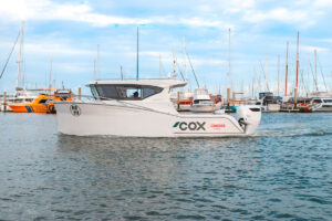 Herley Elite 8 boat in the marina powered by Cox V8 300 Diesel Outboard