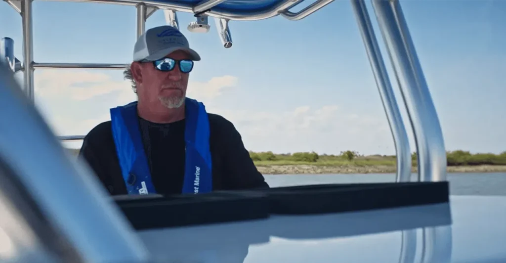 Man on fishing boat powered by Cox diesel outboards